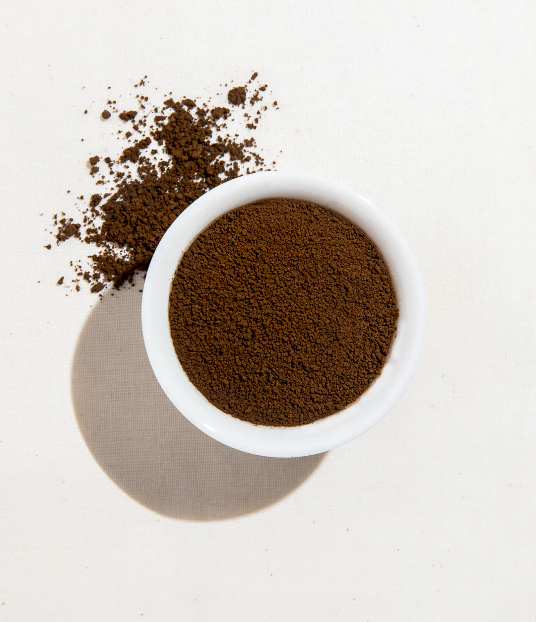 Matcha powder in a white bowl