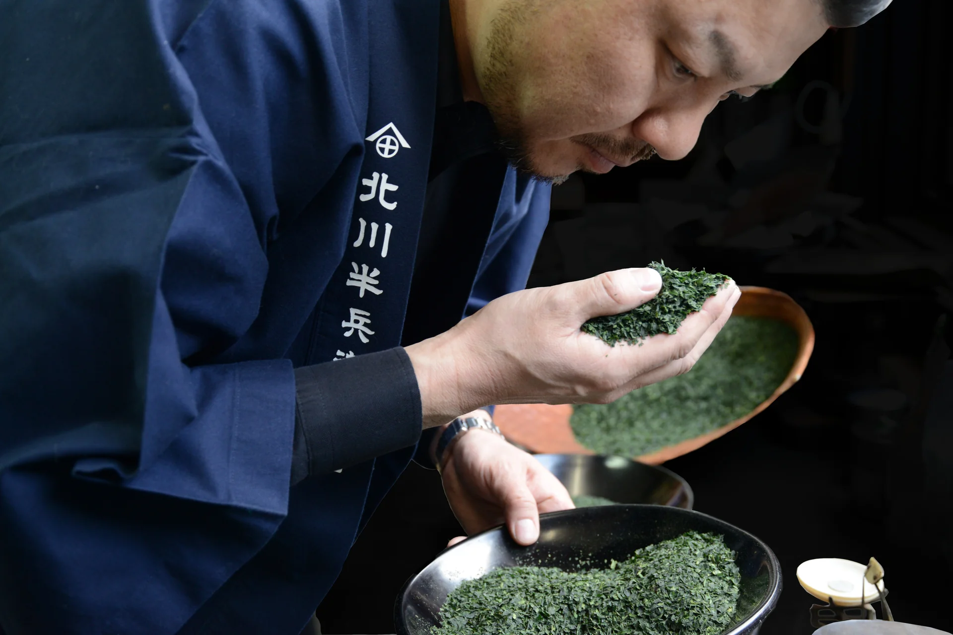 A tea master grading matcha powder
